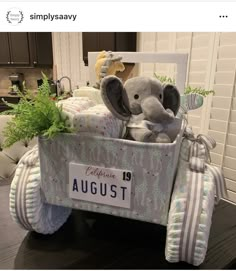 an elephant is sitting in a baby carriage