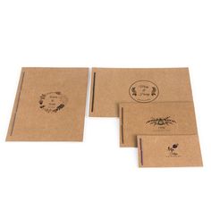 three brown envelopes with stickers on them