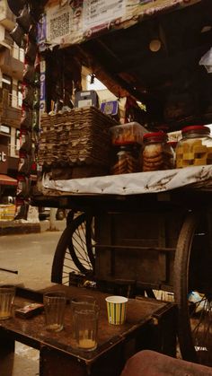 an old cart is loaded with food and drinks