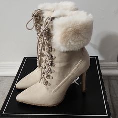 A Never Been Worn Pair Of Qupid Lace Up Boots With Faux Fur Cuff. The Heel Is About 4 Inches, Will Include Box With Purchase. Cream High Heel Winter Boots, Beige Lace-up Heels For Winter, Winter Beige Lace-up Heels, Casual Cream Heels For Winter, Cream High Ankle Heels For Winter, Beige Ankle Boot Heels For Winter, Cream Chic Heels For Winter, Chic Lace-up Winter Heels, Chic Cream Heels For Winter