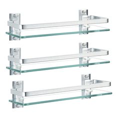 three glass shelves with metal brackets on them