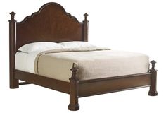 a wooden bed frame with white sheets and pillows on it's headboard, against a white background