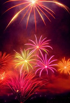 fireworks are lit up in the night sky with bright colors and sparkles on them