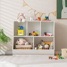 a white shelf filled with lots of toys