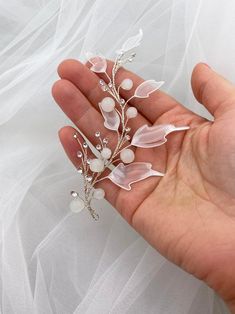 Bridal hair piece with acrylic leaves for a wedding hairstyle. White acrylic leaves with a transparent middle on the thinnest branches of the bridal hair vine for a wedding hairstyle. Silver rhinestones add extra elegance to the hair accessory. White glass beads complete the beauty of the hair accessory.The bridal vine for a wedding hairstyle harmonizes with any white dress. The hair vine is most successfully combined with dresses containing elements of similar colors. It will adorn both blonde Acrylic Leaves, Leaf Hair Piece, Pearl Hair Piece, Frosted Hair, Brunette Makeup, Flower Gift Ideas, Beautiful Tiaras, Bridal Hair Piece, Bridal Hair Vine