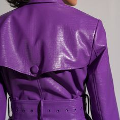 Perfect for transitioning between seasons, this Purple Leather Jacket effortlessly pairs with both casual and dressed-up outfits. Whether you're heading to a social event, a night out, or simply want to add a touch of edge to your everyday style, this jacket is a versatile and chic option.  Pair it with your favourite jeans for a chic and casual vibe or throw it over a dress to add an element of edge to your ensemble. Versatile and stylish, this jacket is a must-have for those who want to infuse Chic Party Outerwear With Zipper Closure, Fitted Faux Leather Outerwear For Party, Spring Faux Leather Belted Outerwear, Fall Party Outerwear With Lapel Collar, Leather Outerwear For Spring, Spring Fashion-forward Leather Outerwear, Fall Evening Outerwear With Double Button Closure, Elegant Fall Outerwear With Zipper Closure, Fashion-forward Leather Outerwear For Spring