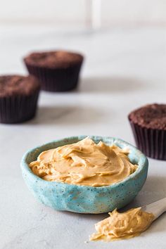 cupcakes with peanut butter frosting in the background