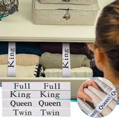 a woman is looking at her purses in the closet with other items on display