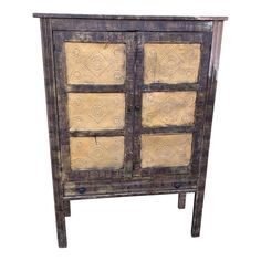 an old wooden cabinet with glass doors and decorative designs on the front, isolated against a white background