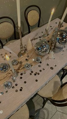 a table with candles and decorations on it