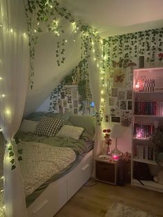 a bedroom decorated in white and green with lots of lights