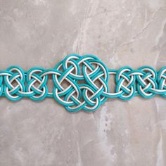 a blue and white bracelet with an intricate design