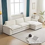 a living room with white furniture and blue curtains