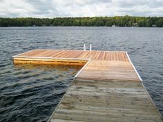 a wooden dock sitting on top of a body of water