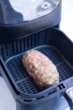 a piece of meat sitting on top of a grill