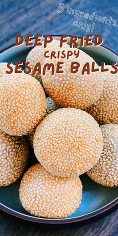 several sesame balls on a blue plate with the words deep fried crispy sesame balls