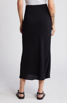 The skirt silhouette of the season is cut to a midi length and ready to top your favorites list. 32" length (size Medium) Lined 100% viscose Machine wash, line dry Imported Casual Flowy Viscose Maxi Skirt, Casual Midi-length Bottoms With Side Slits, Relaxed Fit Midi Pencil Skirt For Daywear, Chic Relaxed Maxi Skirt In Rayon, Chic Relaxed Fit Maxi Skirt In Rayon, Chic Rayon Lined Maxi Skirt, Viscose Flowy Maxi Skirt With Lining, Black Relaxed Fit Viscose Skirt, Summer Viscose Maxi Skirt With Lined Detail