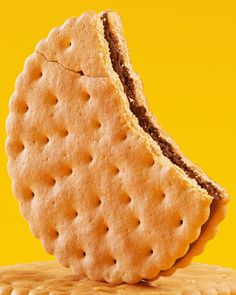 a cracker is sitting on top of a cookie