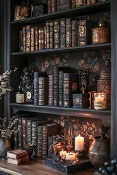 a book shelf filled with lots of books and candles