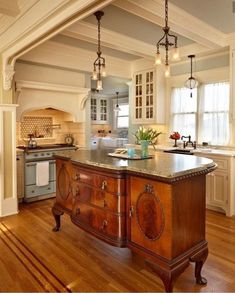 a large kitchen with an island in the middle