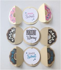 six donuts with different sayings on them are hanging from the side of a wall