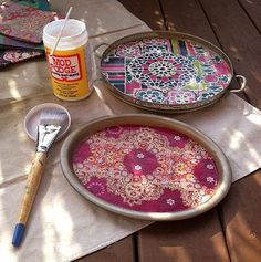 the table is set up with plates and utensils on it, including a paintbrush