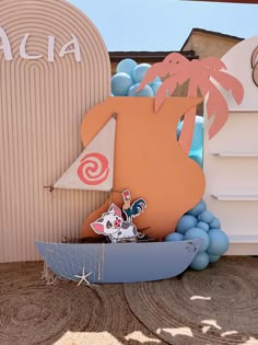 an image of a boat with balloons and decorations on the side of a building that says aha