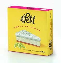 a yellow box with a piece of cake in it on a white surface and limes around the edges