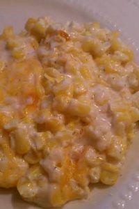 a white plate topped with macaroni and cheese