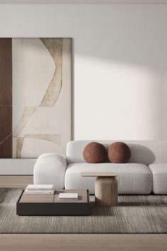 a modern living room with white couches and large painting on the wall behind it