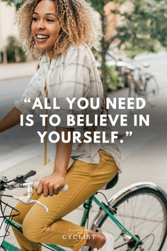 a woman riding a green bike down the street with a quote above her that reads, all you need is to believe in yourself