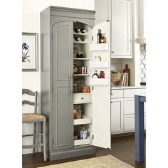 an open pantry in the corner of a kitchen