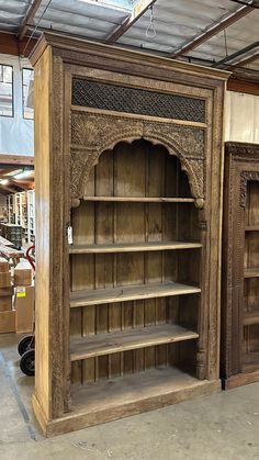 an old wooden bookcase in a warehouse