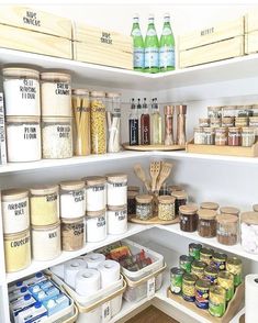 an organized pantry with lots of food and spices on the shelves, including rice flakes