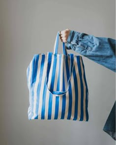 Striped Tote Bag - Blue by OMOM This bag has a spacious fabric case with a wide bottom and double handles. Get a nice inner pocket too. There you can conveniently store the net bags for the fruit and your mobile! Use this tote bag for many years and skip the disposable bags. Manufactured according to the strict require Striped Tote Bag, Denim Tote Bags, Diy Purse, Denim Tote, Net Bag, Paint Shop, Blue Bags, Casual Bags, Blue Stripes