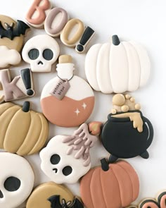 decorated cookies are arranged in the shape of letters and numbers with skulls, pumpkins, jack - o'- lanterns, and more