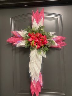 Beautiful Pink Easter Wreath. Handcrafted on a cross wire wreath frame with pink and white poly burlap mesh and finished with lovely pink tulips. Cross Wire Wreath, Auburn Wreath, Cross Wreath, Wire Wreath Frame, Tulip Wreath, Yarn Wreath, Wire Wreath, Easter Cross, Pink Easter