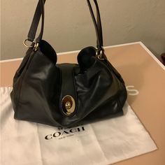 Coach Smooth Leather Carlyle Bag # F37637 Color Midnight Which Is Like A Dark Blue. Bag Is New And Comes With Dust Bag. Coach Hobo Bag With Gold-tone Hardware For Shopping, Formal Crossbody Hobo Bag With Handles, Designer Coach Hobo Bag, Classic Pouch Shoulder Bag, Coach Hobo Tote Bag With Gold-tone Hardware, Coach Shoulder Bag With Double Handle And Branded Hardware, Satchel Hobo Bag With Branded Hardware For Everyday Use, Everyday Satchel Hobo Bag With Branded Hardware, Designer Coach Hobo Bag For Everyday