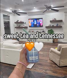 someone holding up a can of tea and the words sweet tea and tennessee on it