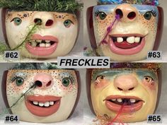 four ceramic faces with different facial expressions and hair on their heads, one has grass growing in his mouth