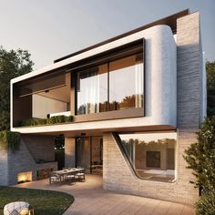 a modern house with an outdoor dining area