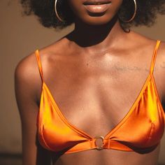 I am the maverick or accent, in Ihuoma’s first collection and your boudoir bra of your dreams, crafted entirely from the most luxurious burnt orange stretch silk. My triangle cups are silk lined offering gently lift with a gorgeous gold hoop detailing at my centre front. Silk wrapped adjustable straps and under-band give you extra support and comfort. Finally, Ihuoma's signature gold clasp closure and a sumptuous silk ribbon that ties delicately at your back. I am perfect worn with Luna Flame Side Tie Knicker and Mawu Copper Kimono for a set that is screaming ‘dare to take me to the beach’. A'isha wears size II (UK 30D/32C/34B/36A) Darted Soft Cup Bralette Gold ring detail at centre front Gold Clasp fastening at back Additional silk ties at back Mix and match with any Ihuoma style Composit I Am Perfect, Small Atelier, St Claire, Baby Skin Care, Male Grooming, Silk Wrap, Soft Cup, Silk Ribbon, Gold Hoop