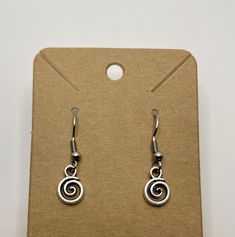 Cute swirl earrings; earring hooks are sterling silver and hypoallergenic; includes rubber backing. Silver Adjustable Hypoallergenic Wrap Earrings, Adjustable Hypoallergenic Sterling Silver Wrap Earrings, Adjustable Spiral Earrings For Gifts, Swirl Hoop Earrings Nickel Free Gift, Spiral Earrings With Ear Wire For Gifts, Silver Adjustable Spiral Wrap Earrings, Spiral Earrings With Ear Wire As Gift, Adjustable Spiral Sterling Silver Wrap Earrings, Adjustable Nickel-free Silver Wrap Earrings