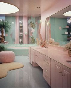 a pink bathroom with palm trees and other decorations