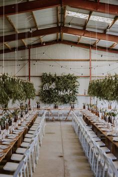 an indoor venue with long tables and chairs