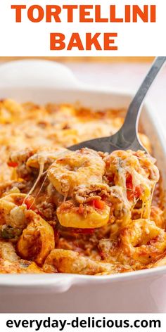 a white casserole dish filled with tortellini bake