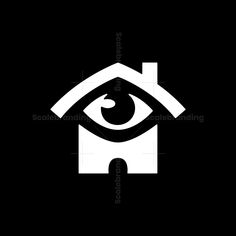 an eye is seen in the center of a house with a bird on it's roof