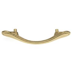 a brass plated metal handle on a white background