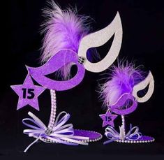 two purple and white mardi gras decorations