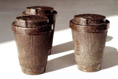 three coffee cups sitting next to each other